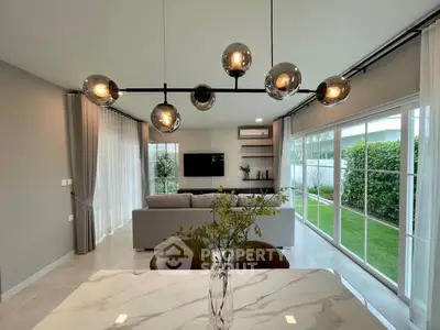 Modern living room with stylish lighting and garden view