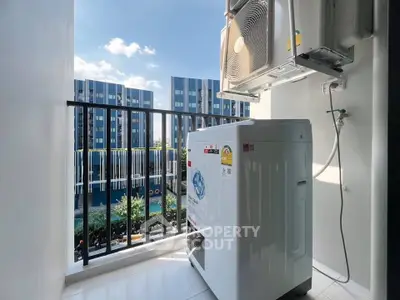 Modern apartment balcony with washing machine and city view