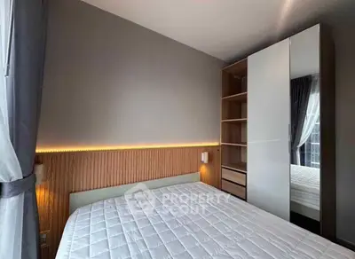 Modern bedroom with sleek wardrobe and ambient lighting