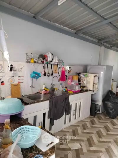 Spacious kitchen with modern appliances and ample storage space, perfect for culinary enthusiasts.