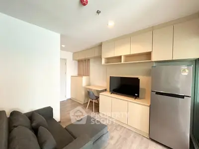 Modern living room with sleek furniture and built-in storage in a cozy apartment.