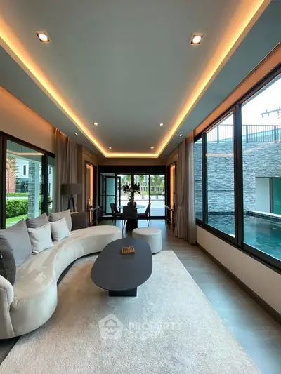 Luxurious living room with pool view and modern design