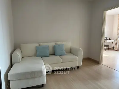 Spacious living room with modern sofa and natural light