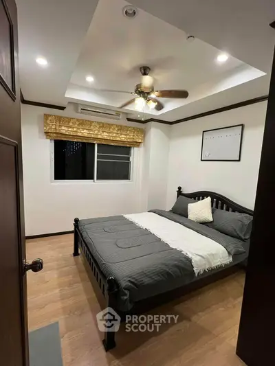 Cozy bedroom with modern ceiling fan and elegant decor