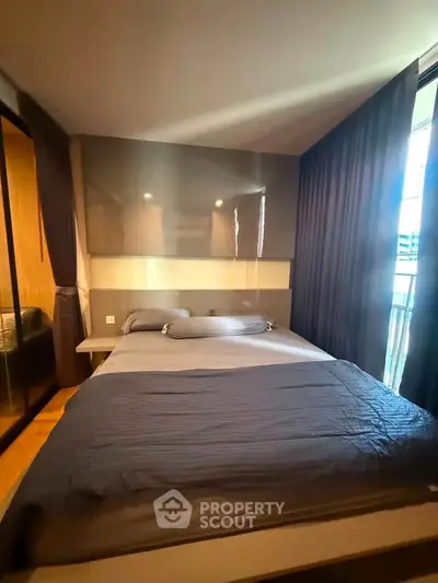 Cozy bedroom with modern design and ample natural light