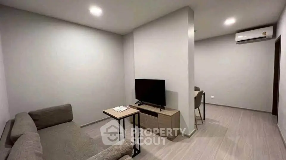 Modern living room with sleek furniture and neutral tones