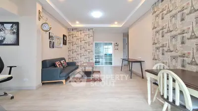 Spacious living room with stylish decor and ample natural light, perfect for modern living.
