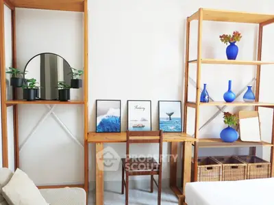 Stylish study area with wooden shelves and modern decor in a cozy home setting.