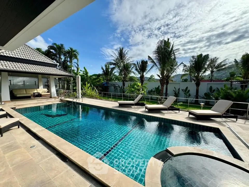 Luxurious villa with private pool and tropical garden, perfect for relaxation and leisure.