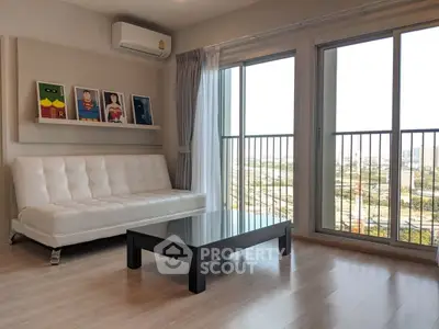 Modern living room with white sofa, superhero art, and large windows offering city views.