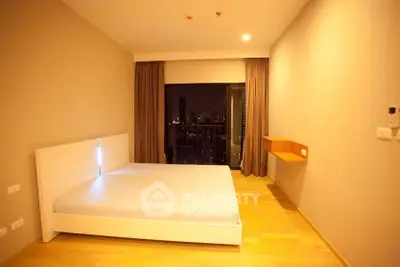 Spacious bedroom with city view and modern minimalist design