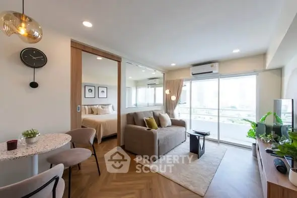 Modern living room with open layout and balcony view in stylish apartment