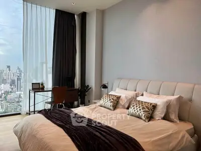 Luxurious bedroom with stunning city view, modern decor, and elegant furnishings in high-rise apartment.
