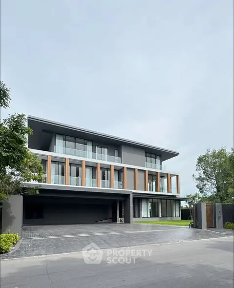 Modern luxury three-story house with sleek design and spacious driveway