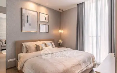 Elegant bedroom with modern decor and large window for natural light