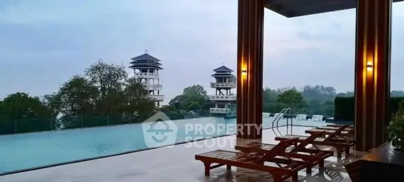 Luxurious poolside view with elegant loungers and scenic surroundings.