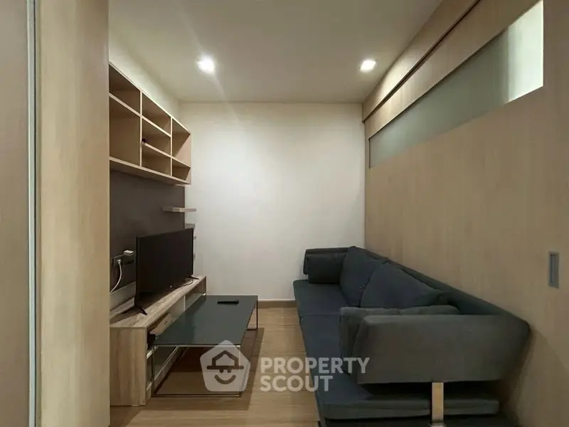 Modern living room with sleek furniture and built-in shelving