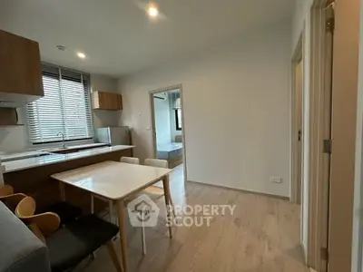 Modern open-layout kitchen and dining area with natural light