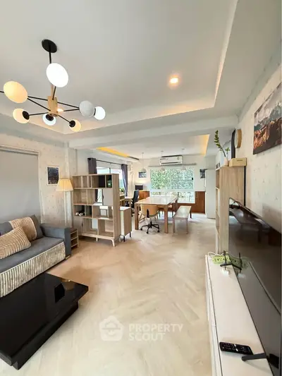 Spacious modern living room with stylish decor and natural light