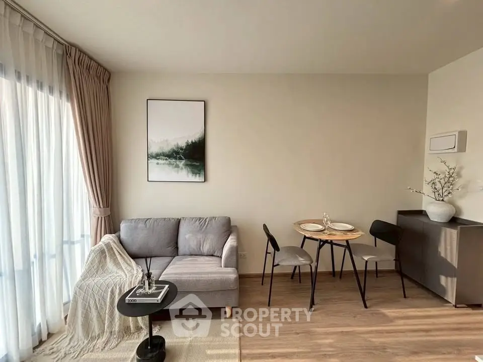 Chic modern living room with cozy sofa and dining area, perfect for urban living.