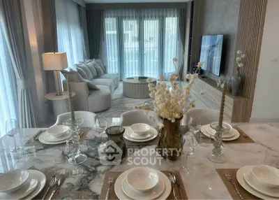 Luxurious living room with elegant dining setup and modern decor
