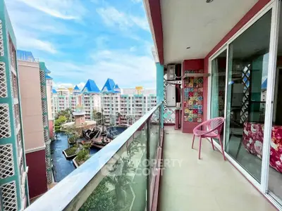 Spacious balcony with stunning view of colorful buildings and canal