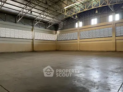 Spacious industrial warehouse with high ceilings and ample natural light