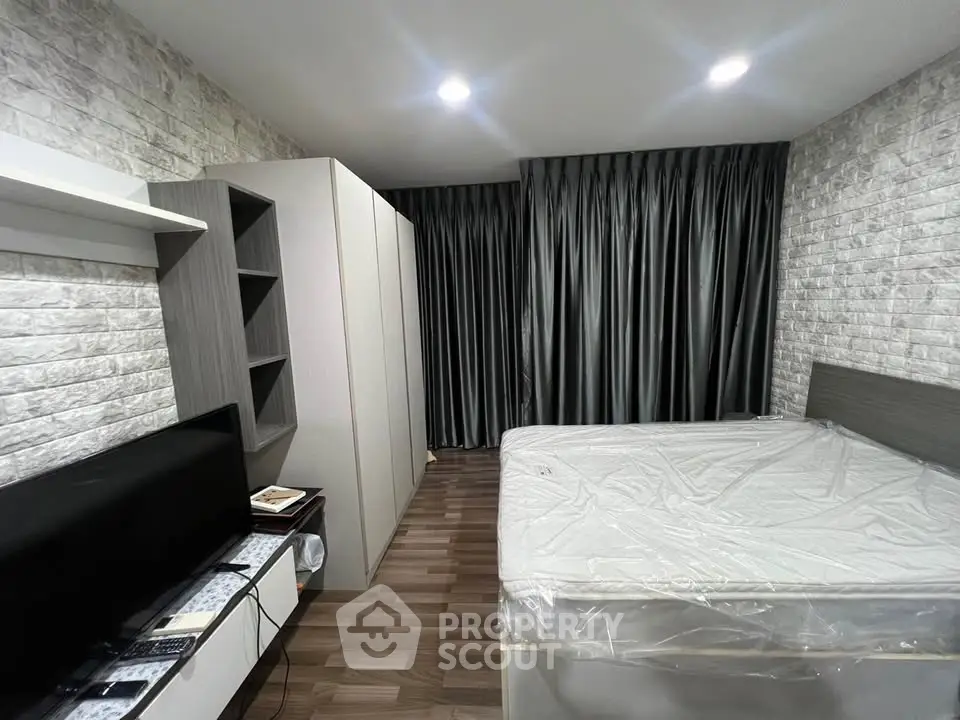 Modern bedroom with stylish decor and ample storage space