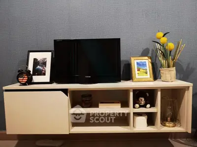 Modern living room with sleek TV stand and stylish decor accents