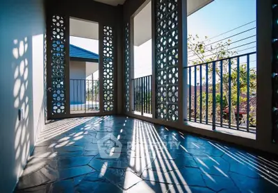 Spacious balcony with decorative panels and scenic view, perfect for relaxation and outdoor enjoyment.