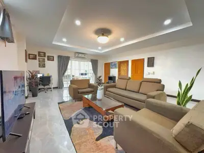 Spacious modern living room with elegant decor and ample natural light