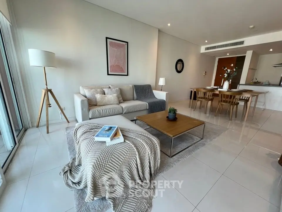 Spacious modern living room with elegant decor and open dining area
