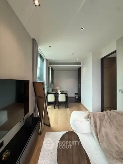 Modern living room with sleek furniture and natural light, perfect for urban living.