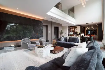 Luxurious modern living room with high ceilings and elegant decor