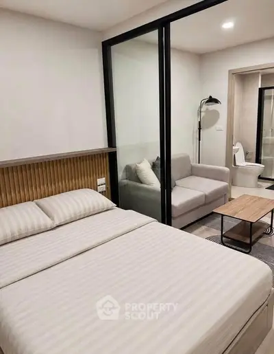 Modern studio apartment with cozy bedroom and stylish living area