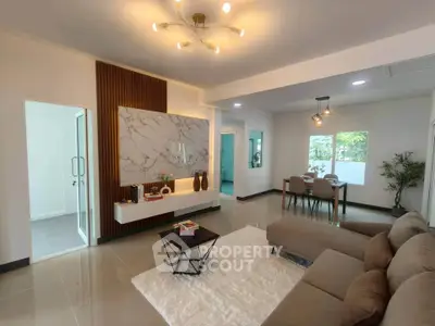 Spacious modern living room with elegant decor and natural light