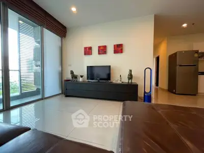 Modern living room with sleek furniture and balcony view