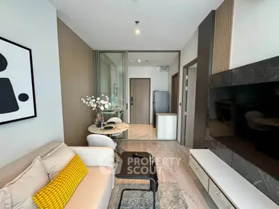 Modern living room with stylish decor and open kitchen layout