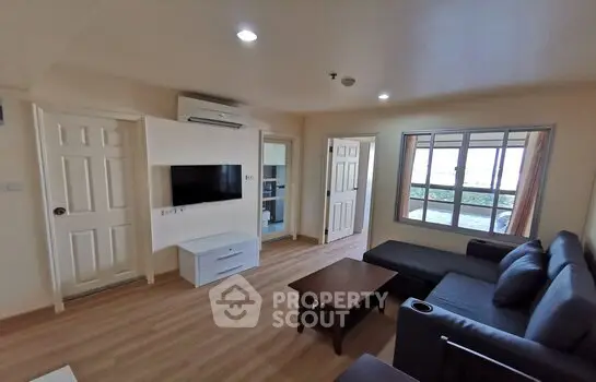 Spacious living room with modern furniture and natural light