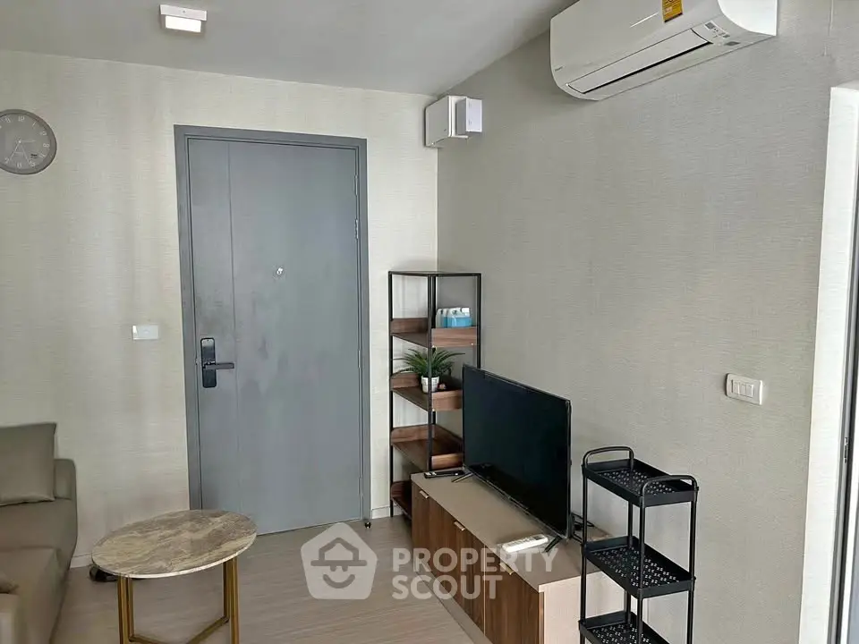 Modern living room with air conditioning and stylish furniture