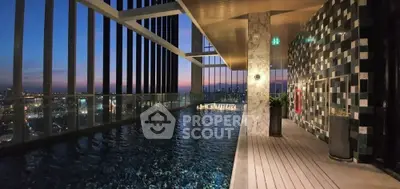 Luxurious rooftop pool with stunning city view at sunset, perfect for relaxation and entertainment.