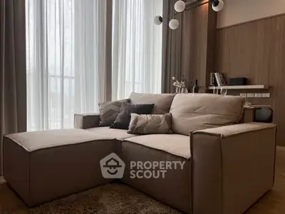 Modern living room with cozy beige sofa and elegant decor