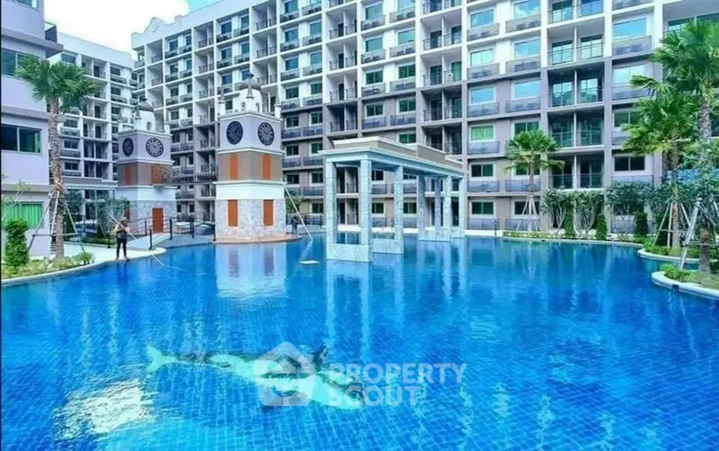 Luxurious condominium with stunning pool and modern architecture, perfect for resort-style living.