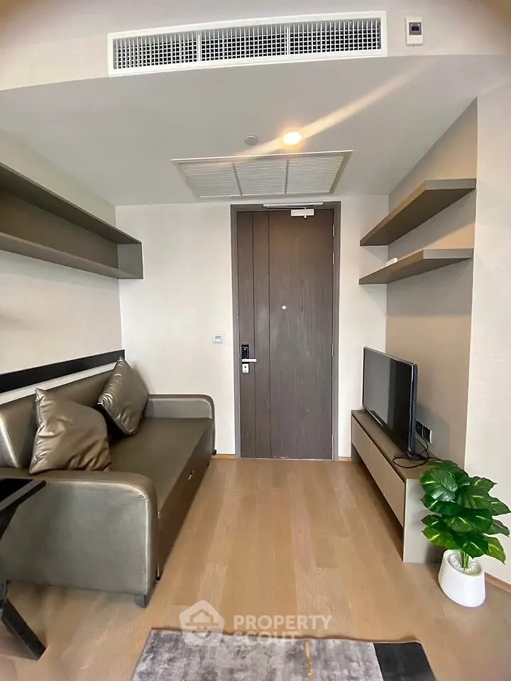 Modern living room with sleek furniture and wooden flooring