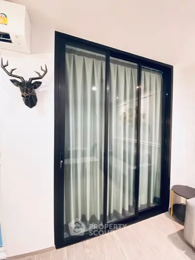 Modern interior with sliding glass door and stylish decor