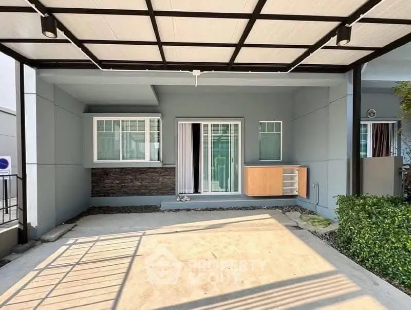 Modern home exterior with covered parking and stylish facade