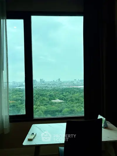 Stunning cityscape view from a high-rise apartment window, perfect for urban living enthusiasts.