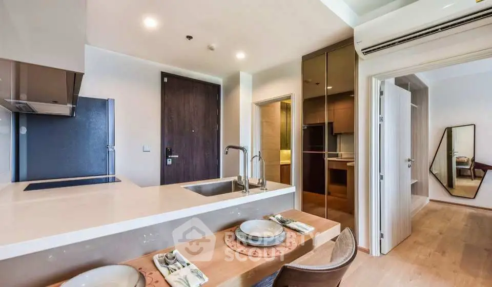Modern kitchen with open layout and sleek design in a stylish apartment