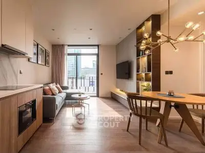 Modern living room with open kitchen, stylish lighting, and city view balcony in a chic apartment.