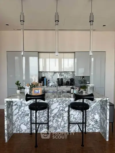 Luxurious modern kitchen with marble island and sleek appliances